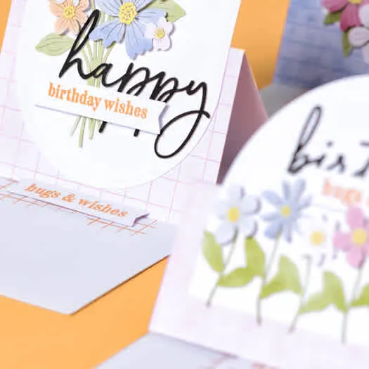 Three handmade easel-style birthday cards from the July 2026 Paper Pumpkin Kit featuring colorful flowers and holographic accents.