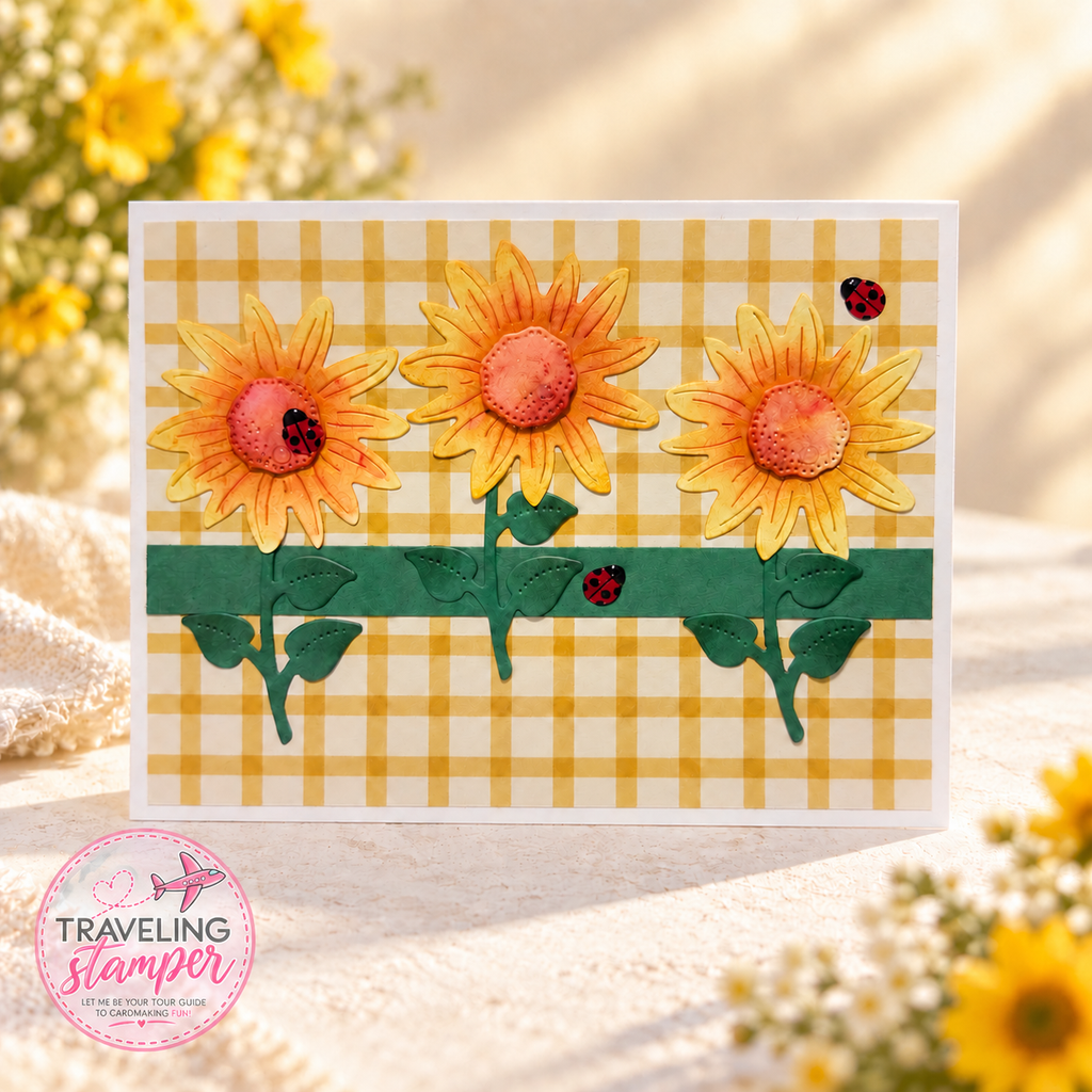 Handmade sunflower card with three yellow and orange flowers, green leaves, yellow gingham paper, and red ladybug embellishments.